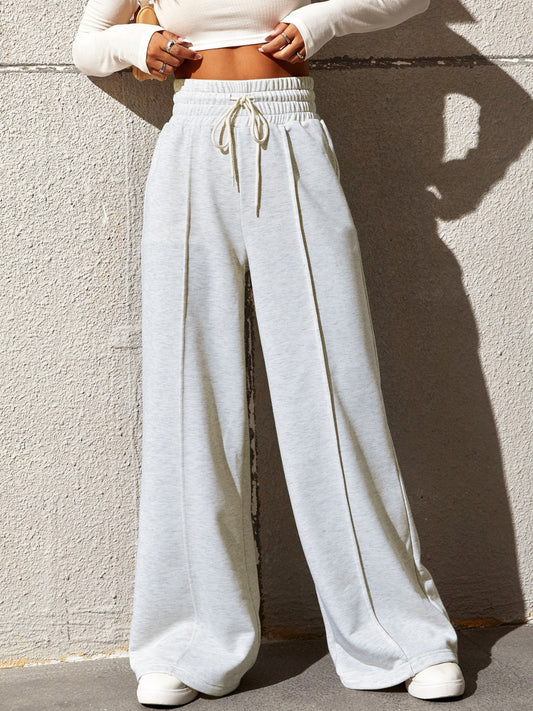 Pantalones anchos con cintura elástica y cordón de color miel