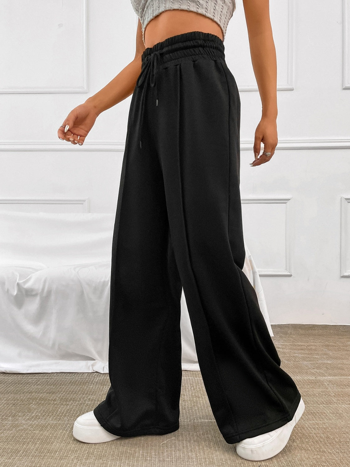 Pantalones anchos con cintura elástica y cordón de color miel